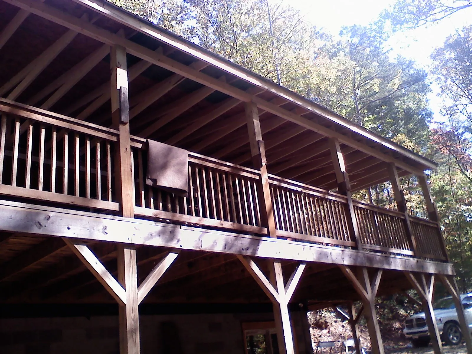 Timber framing under a new elevated porch and deck — Roof Leak Repair in Flint by Roofing Brothers